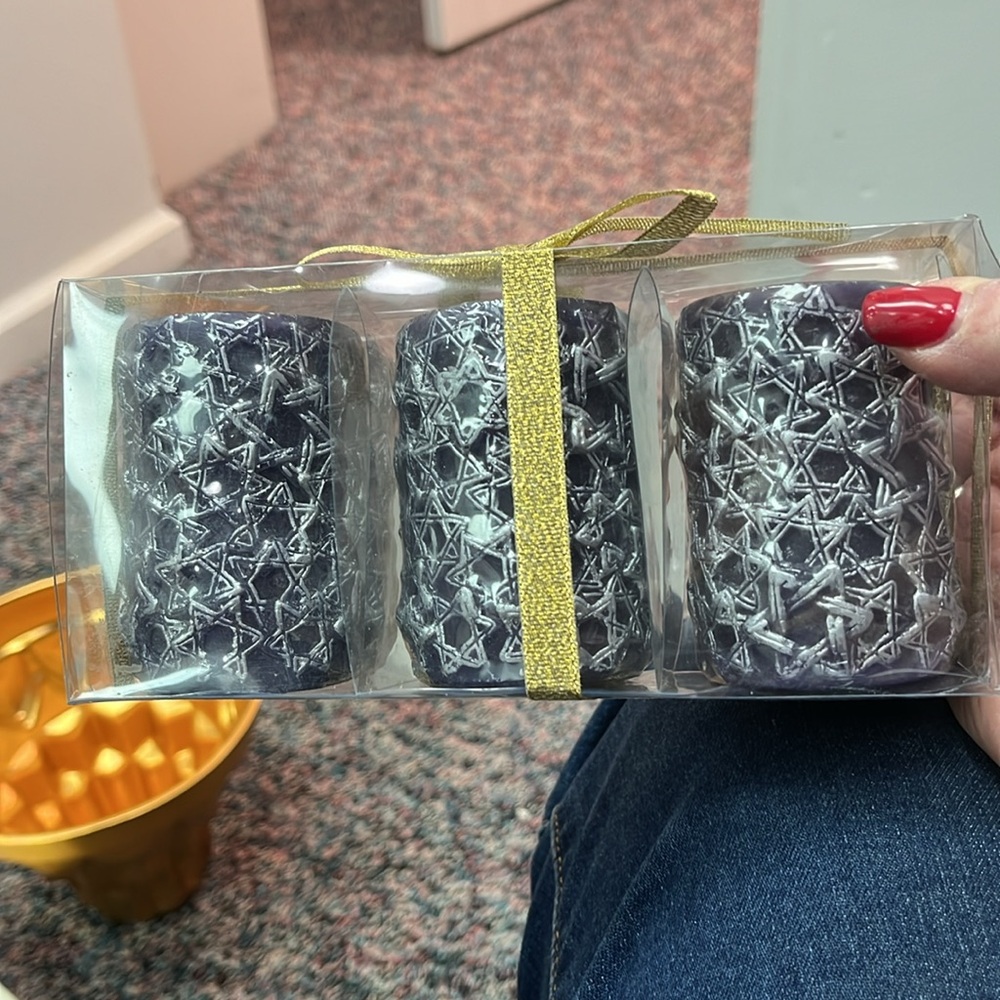 Three beautiful candles. Never been used never been opened.